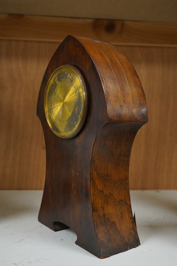 An Art Nouveau copper inlaid oak timepiece, 27cm high. Condition - various elements of copper inlay missing or detached